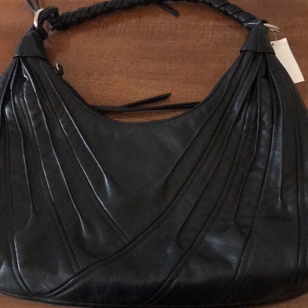 Pretty black pocketbook fringe on one side one inside zipper compartment.